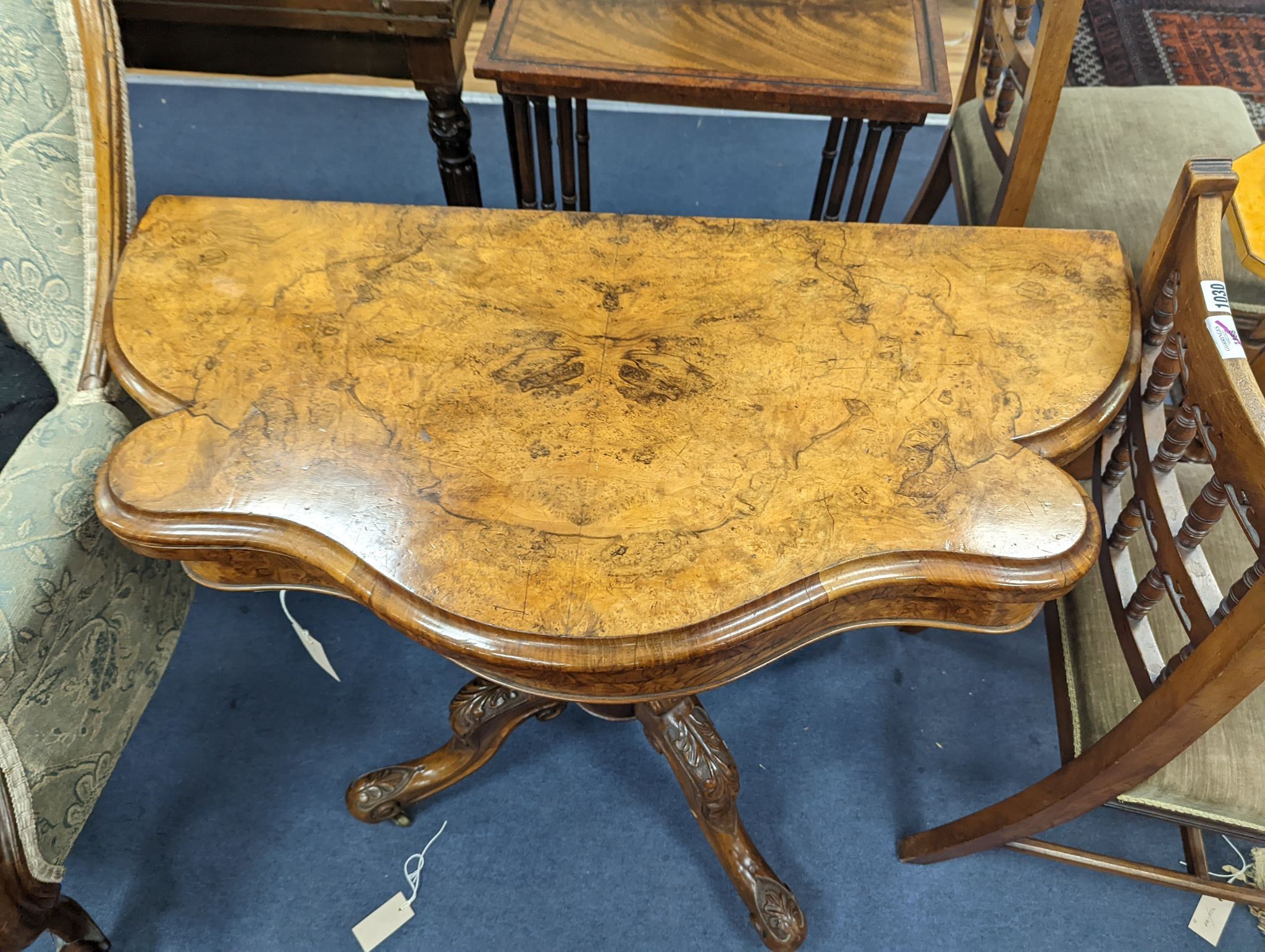 A Victorian figured walnut serpentine folding card table, width 92cm, depth 45cm, height 73cm